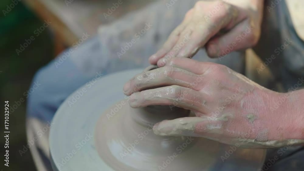 The hands of the master potter, makes a pot of clay. Traditional crafts The hands of the master potter, makes a pot of clay. Traditional crafts