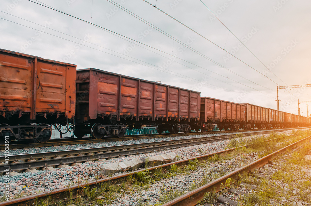 Freight wagons with solid cargo on the railway Freight wagons with solid cargo on the railway