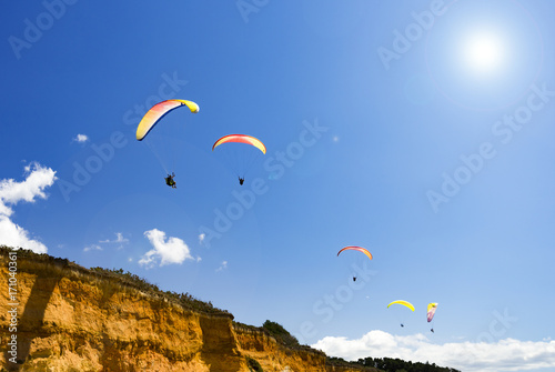 Paragliding over Brittany Beach cliffs