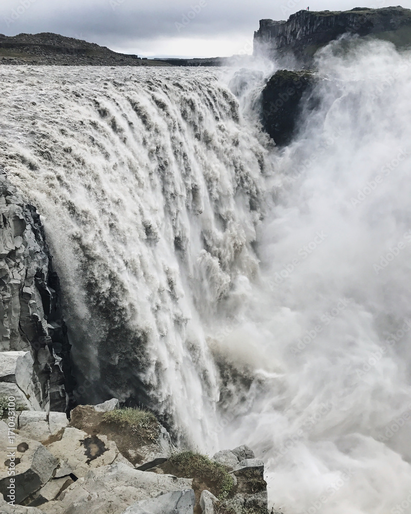 Fototapeta premium Detifoss waterfall in Iceland in misty and rainy weather in highlands. Famous place of Iceland, The most powerful waterfall in Europe