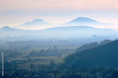 Hills in winter with fog