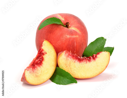 Peach and slice with a green leaf isolated on white background