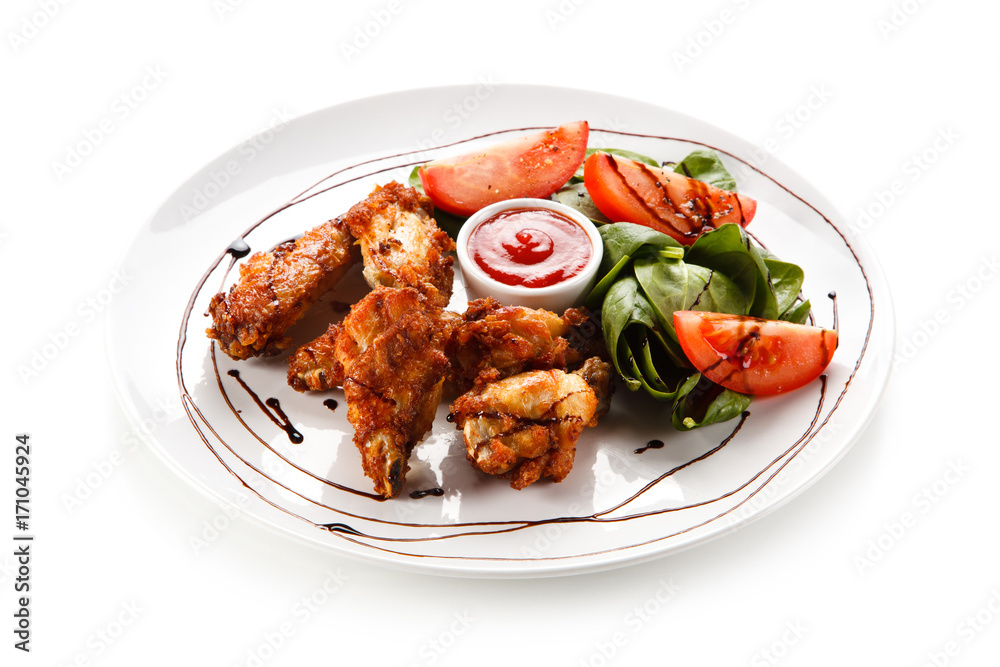 Grilled chicken drumsticks on white background 