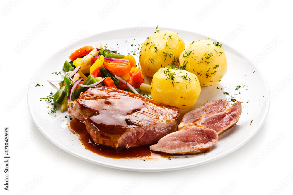 Grilled steak with vegetables on white background Grilled steak with vegetables on white background
