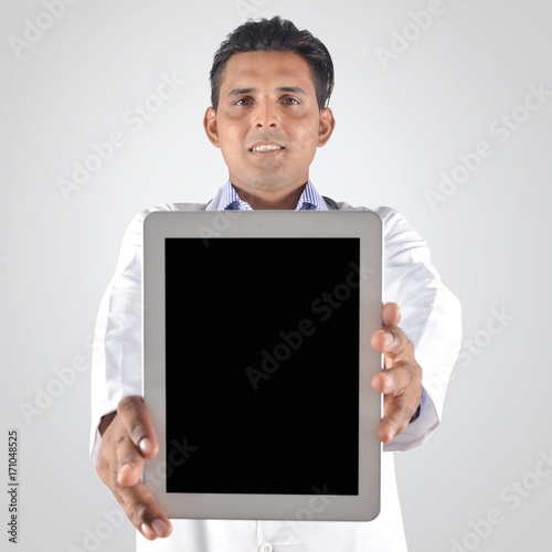 Doctor showing blank tablet pc screen