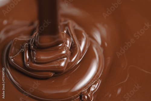 pouring melted premium dark chocolate