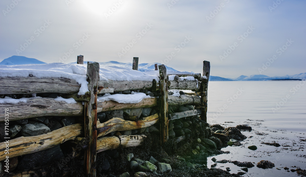 Fototapeta premium Old jetty by the coast in Tromsø