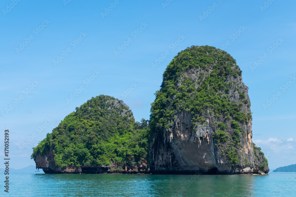Limestone mountain with blue sky at Phra Nang cave beach