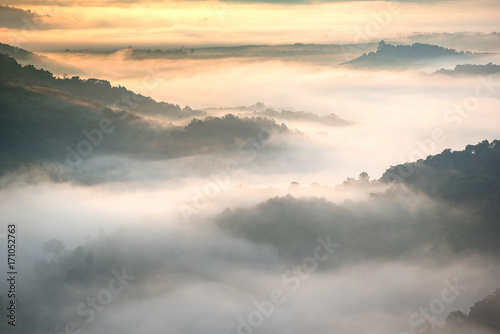 Beautiful fog mountain in mist. Sunrise in the mountains landscape. Loei, Thailand, Asia.