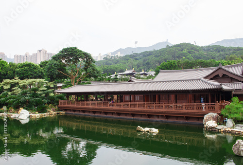 Antique wooden houses on the lake and garden.