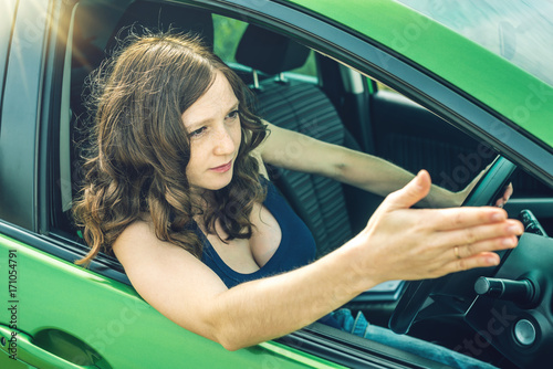 Obraz na plátně Angry and frustrated woman driver in the car