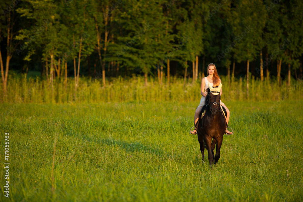 Active young woman ride a horse in nature Active young woman ride a horse in nature