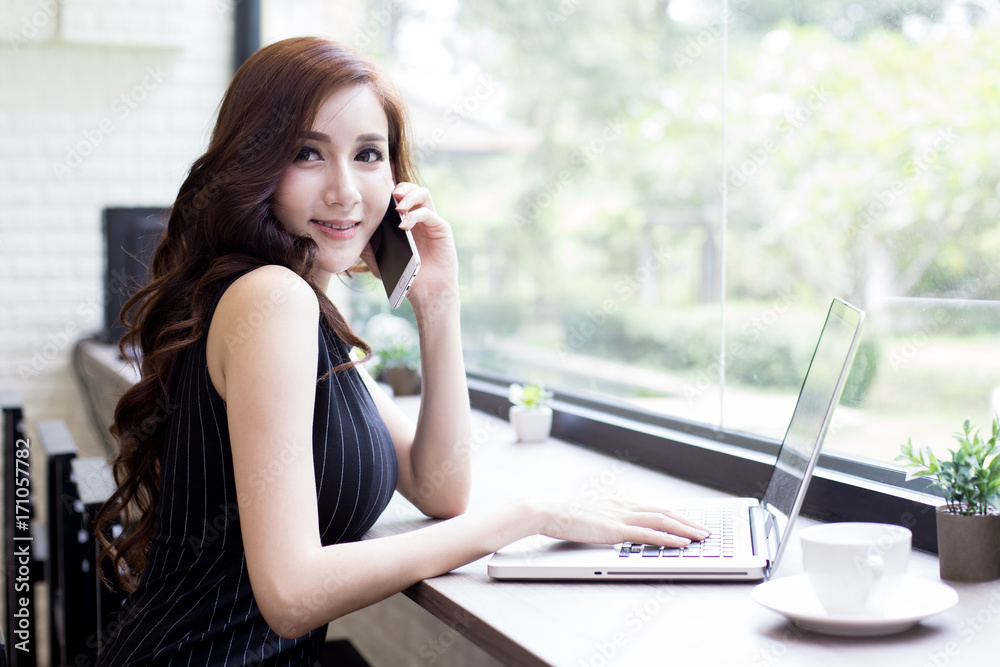 Asian Woman using Laptop for Work at office. Smiling Businesswoman work at office Concept. Asian Woman using Laptop for Work at office. Smiling Businesswoman work at office Concept.