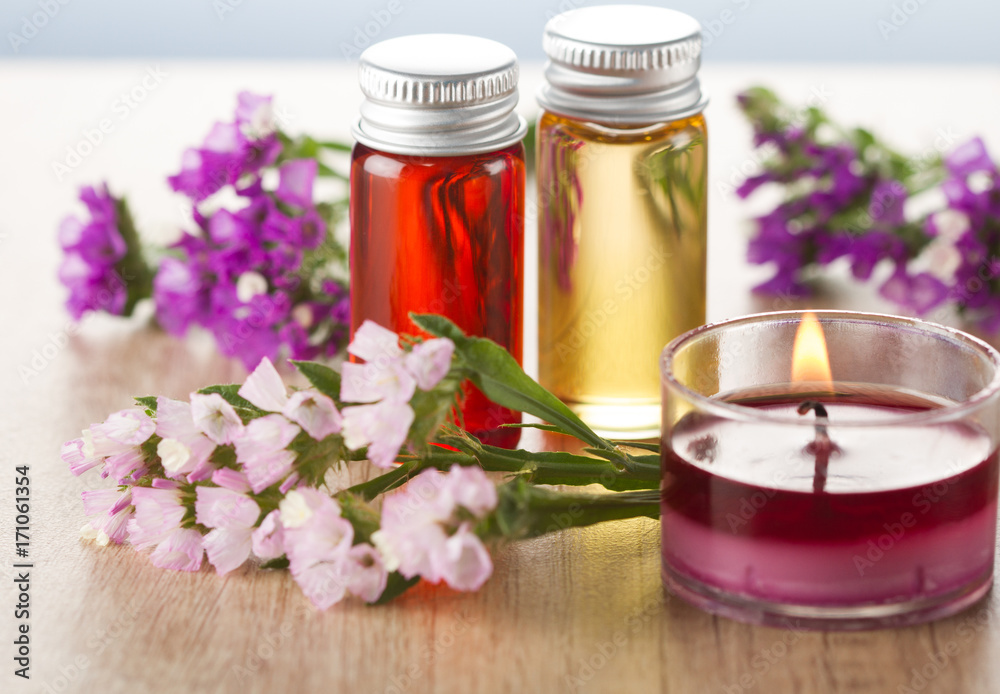 Essential oils, flowers and candle.Spa concept Essential oils, flowers and candle.Spa concept