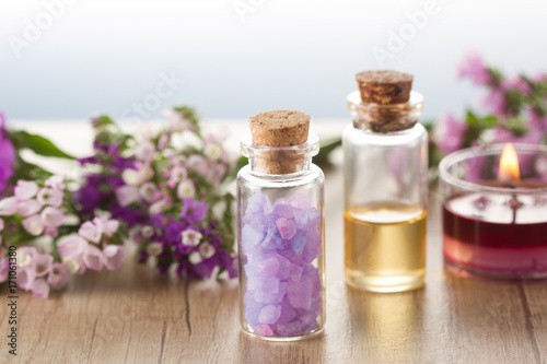 Essential oil sea salt  flowers and candle.Spa concept