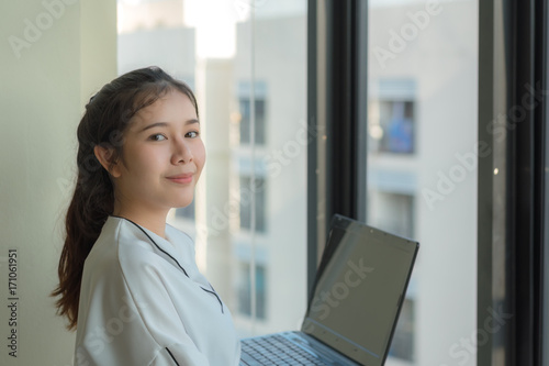 asian freelance work concept : smile women use laptop modern business technology