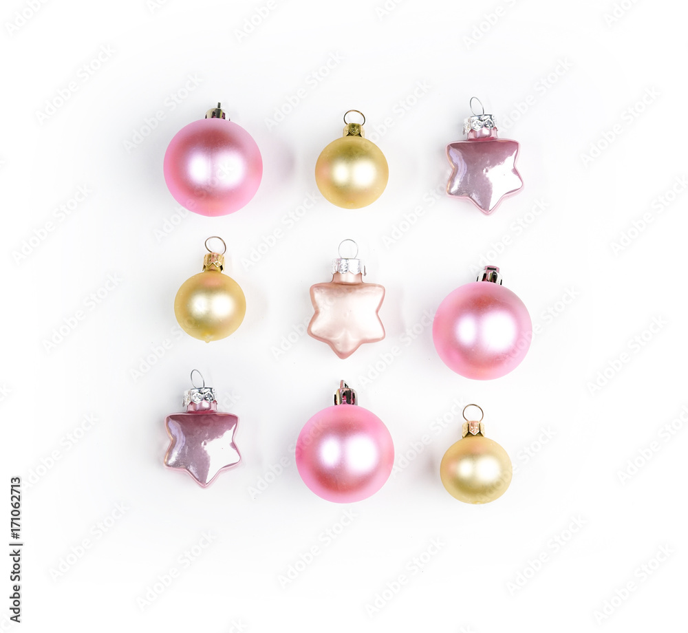 Set of round and in the form of a star Christmas toys isolated on white background. Bright New Year's toys pink and gold color.