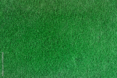 Closeup texture of golf green made of artificial grass. Putting green is a part of golf course, top view for use background.