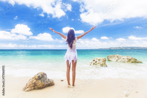 Woman in dress on beach