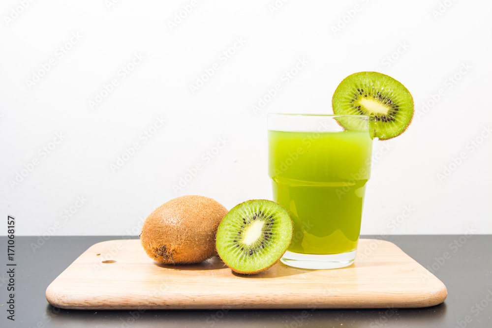 Kiwi on cutting board with white background Kiwi on cutting board with white background