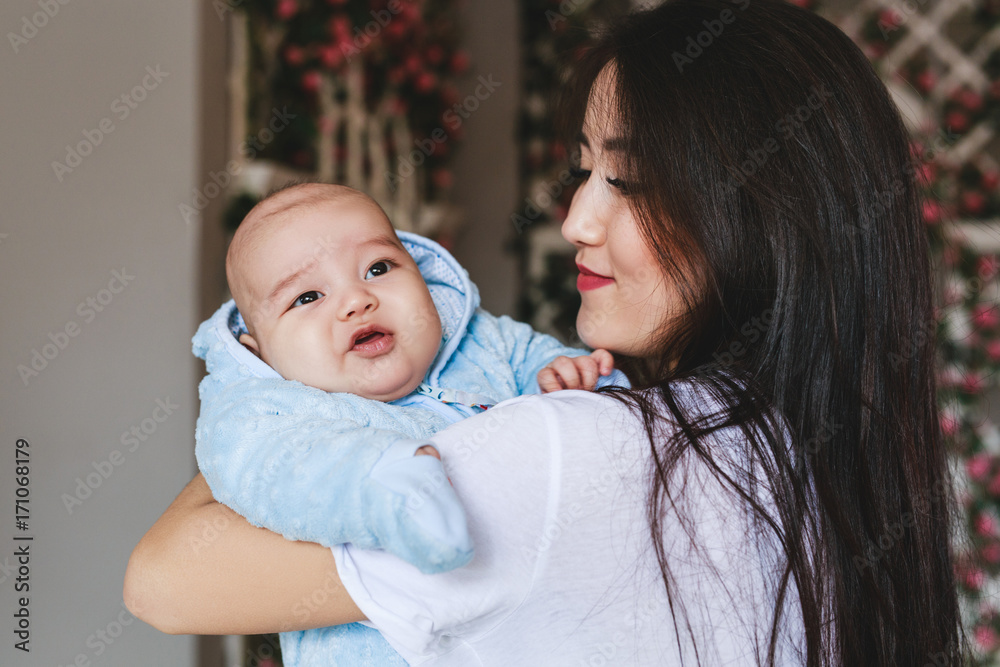 Loving Asian Mother Holding Baby Son At Home Loving Asian Mother Holding Baby Son At Home