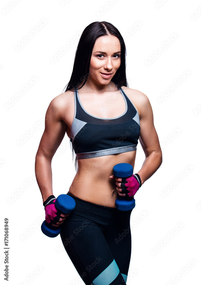 Beautiful young woman do exercises with dumbbells in studio. Sporty athletic girl lifting up weights against white background. Beautiful young woman do exercises with dumbbells in studio. Sporty athletic girl lifting up weights against white background.