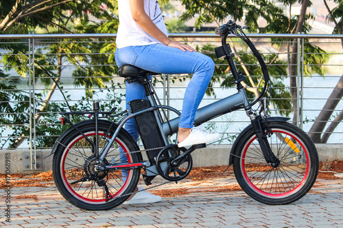 Women with electric ebike With lake view