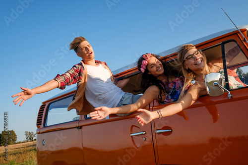 Hippie friends in a van on a road trip