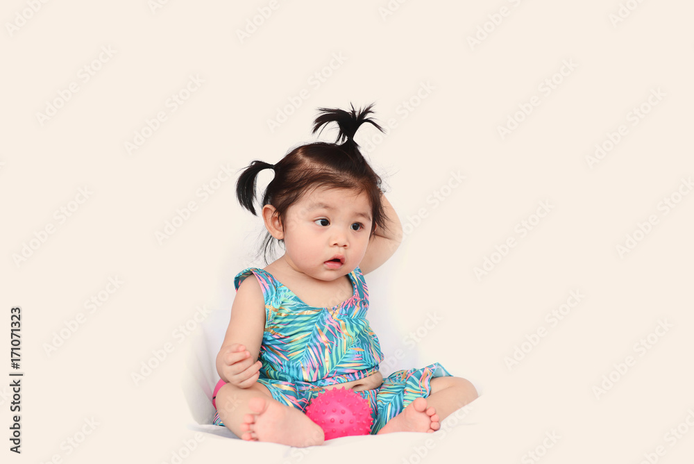 Asian cute baby girl in swimming suit sitting Asian cute baby girl in swimming suit sitting