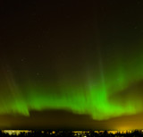 Intense northern lights (Aurora borealis) over city of Riga