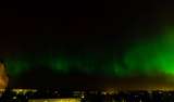Intense northern lights (Aurora borealis) over city of Riga