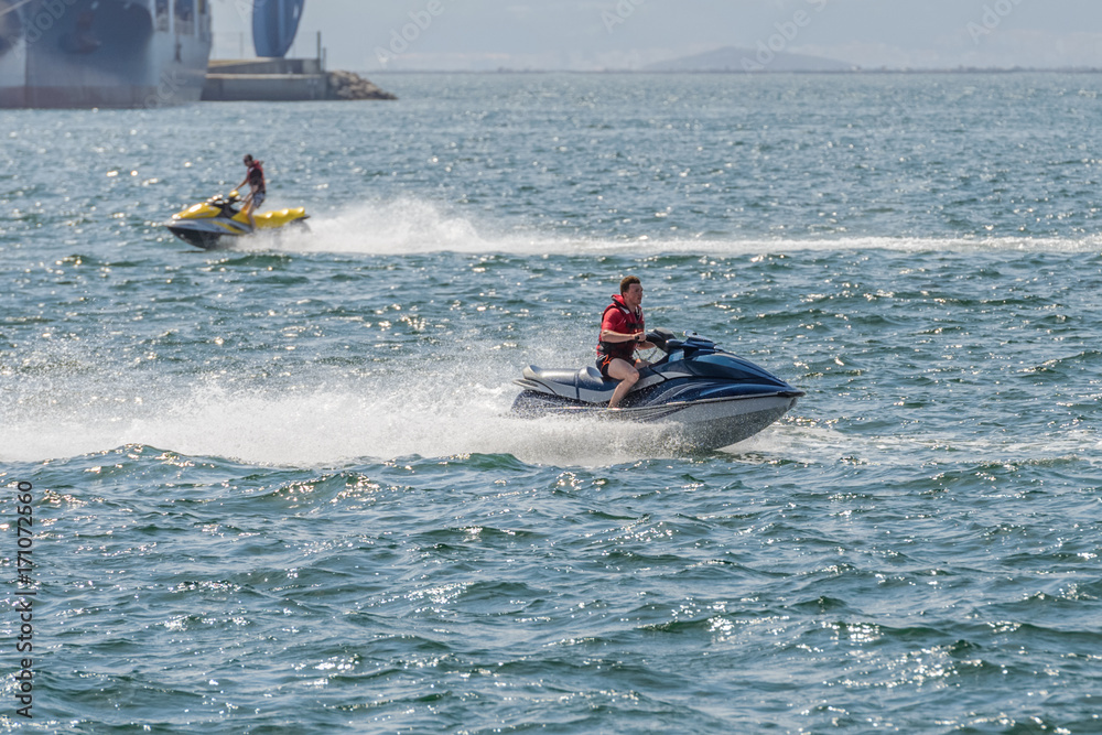 Obraz premium young man on a jet ski on the sea