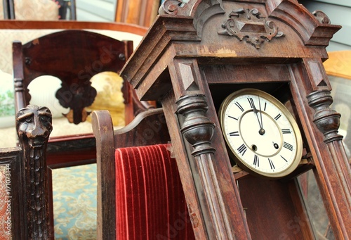Old vintage watches and old chairs and things on the flea market.