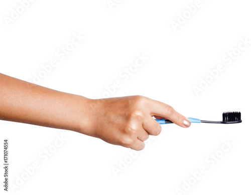 Female hand holding a Toothbrush with toothpaste isolated on white background