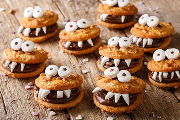 Toothed monsters of cookies close-up for Halloween. horizontal