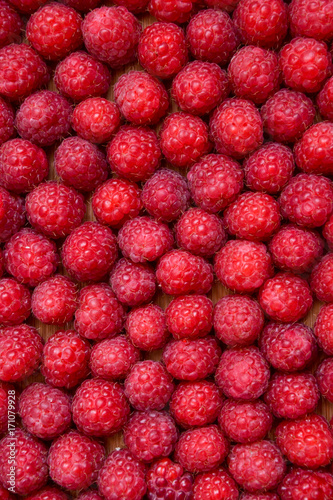 Raspberry organic background. Fresh raspberries from village garden. Ecological berries for desserts, cakes, smoothie or jam.