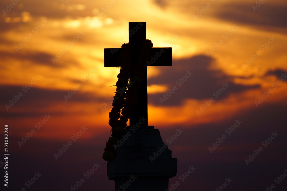 Silhouette of the cross on the beautiful sunset