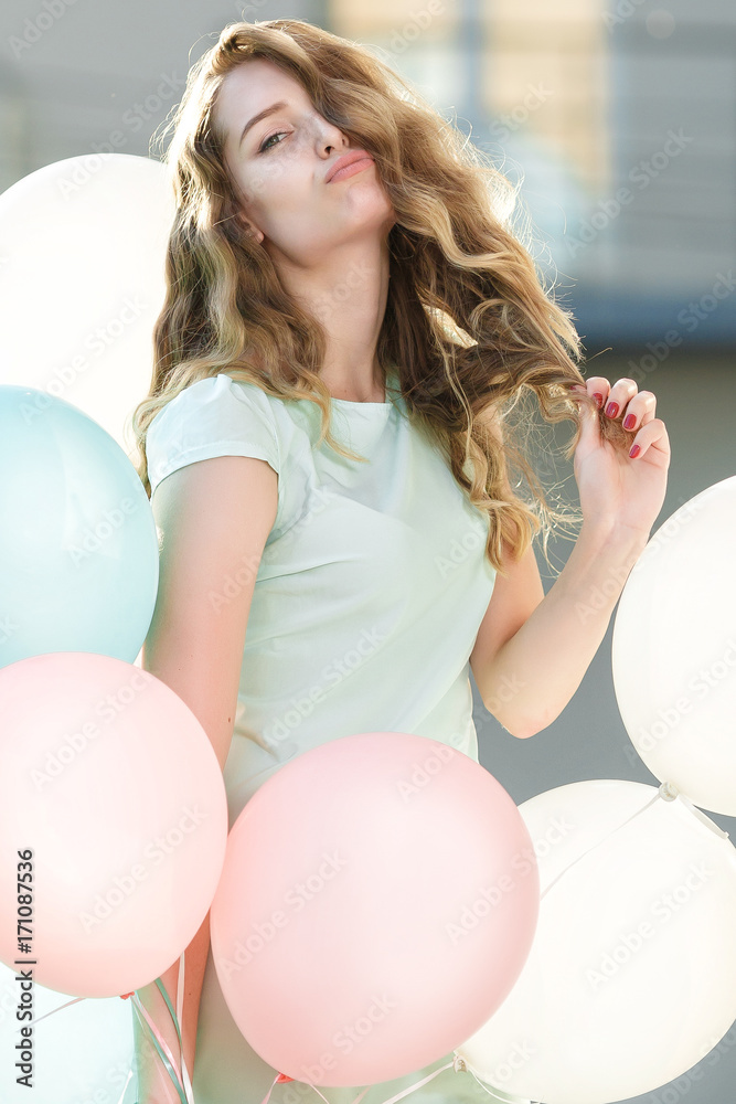 beautiful woman with flying multicolored balloons beautiful woman with flying multicolored balloons