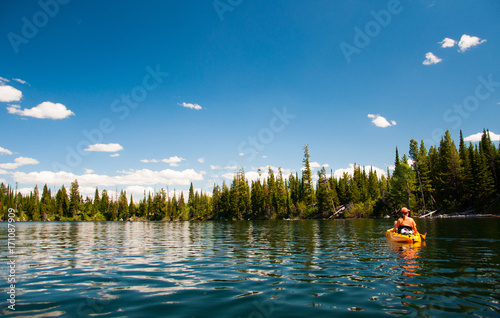  Woman kayaking on Lake Jenny in Grand Tetons National Park photo