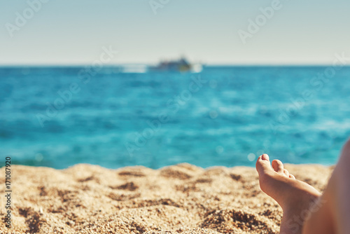 Woman relaxing on the beach.