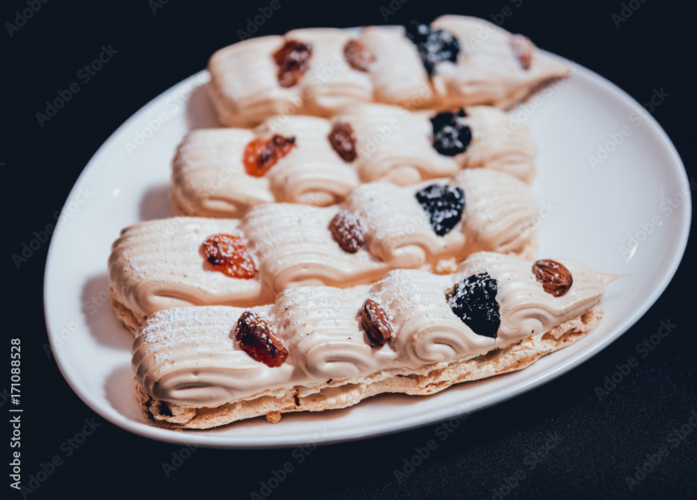 French meringue cookies on the white plate. French meringue cookies on the white plate.