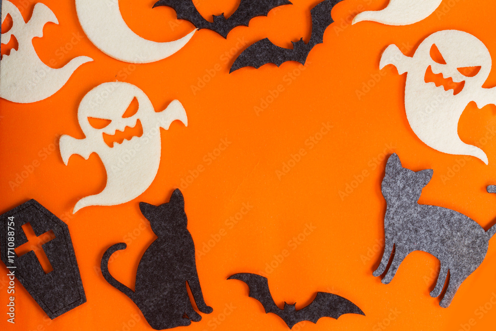Halloween flat lay scene on orange background with copy space Halloween flat lay scene on orange background with copy space