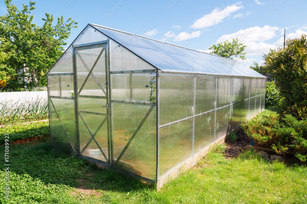 Greenhouse made of polycarbonate in the garden