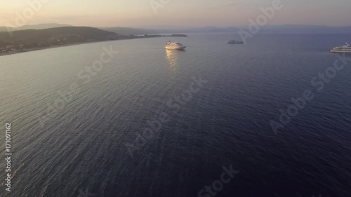 Aerial view of big motor yacht with helicopter place/ Drone flying over it