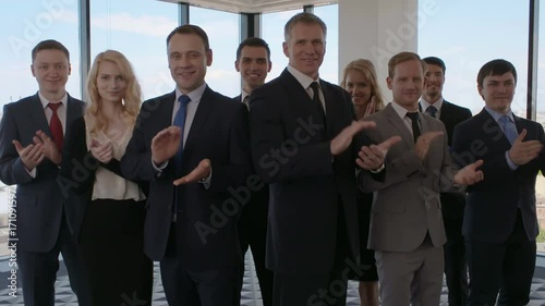 Portrait of business people people standing and applauding