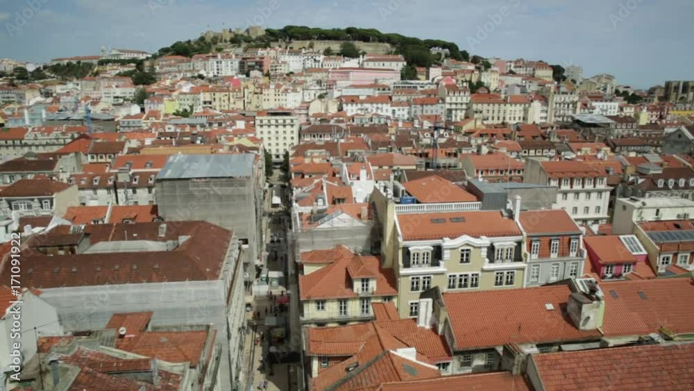 Aerial view over Lisbon, Portugal, sunny day. Details of Monastery of Sao Vicente of Fora and Sao Jorge Castle from panoramic platform of Elevador de Santa Justa popular tourist attraction in Baixa. Aerial view over Lisbon, Portugal, sunny day. Details of Monastery of Sao Vicente of Fora and Sao Jorge Castle from panoramic platform of Elevador de Santa Justa popular tourist attraction in Baixa.