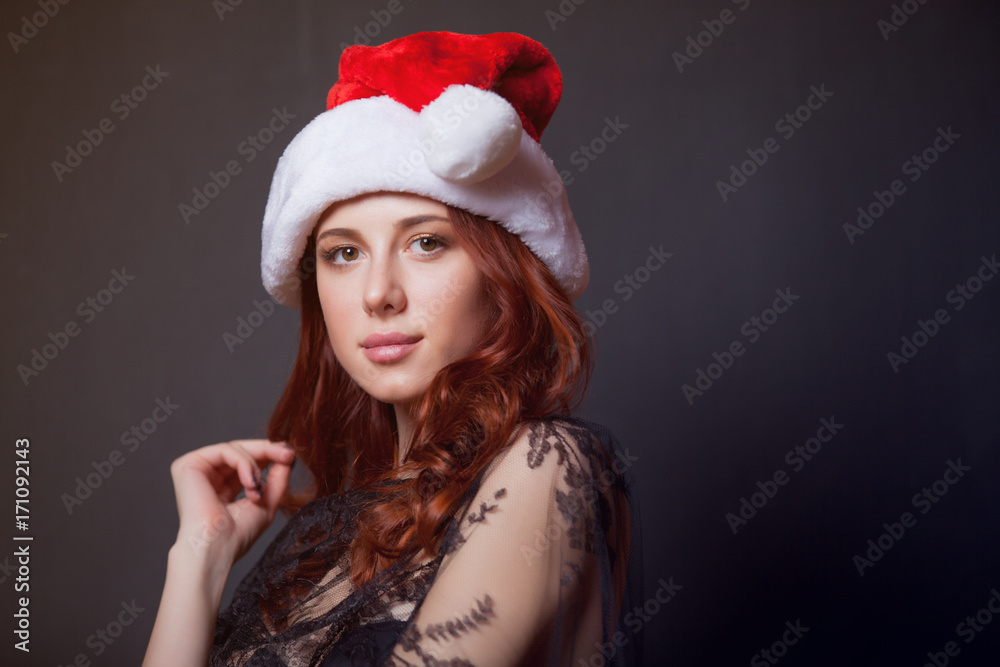 Portrait of young redhead woman in Santa Claus hat Portrait of young redhead woman in Santa Claus hat