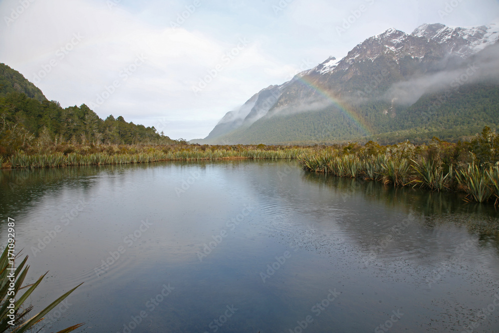 Wintertime rainbow forms beside the Te Anau to Milford Highway, New Zealand