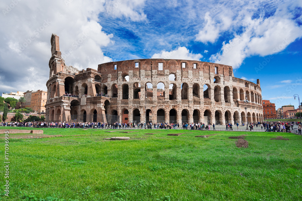 ruins of antique Colosseum building at spring day in Rome Italy