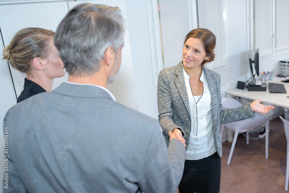 investment advisor shaking hands with man investment advisor shaking hands with man